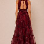 "Burgundy floral tulle tiered maxi dress with plunging halter neckline and open tie-back."

