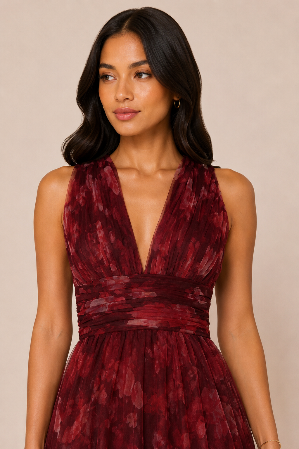 "Burgundy floral tulle tiered maxi dress with plunging halter neckline and open tie-back."
