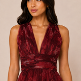 "Burgundy floral tulle tiered maxi dress with plunging halter neckline and open tie-back."
