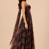 "Dark floral tulle strapless maxi dress with sweetheart bodice and detachable sheer scarf."
