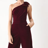 BERRY AFTER DARK VELVET BOW ONE-SHOULDER JUMPSUIT