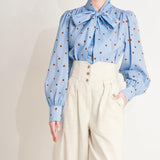 THE POLKA POWER MOVE WOVEN TOP