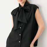 MODERN STATEMENT BOW WOVEN TOP