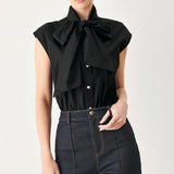 MODERN STATEMENT BOW WOVEN TOP