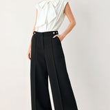 MODERN STATEMENT BOW WOVEN TOP