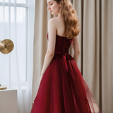 Elegant Strapless Burgundy Tulle Ball Gown with Corset Back and Ribbon Tie