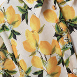 Romantic dress with waistband and lemon print and short sleeves