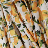 Romantic dress with waistband and lemon print and short sleeves