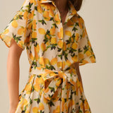 Romantic dress with waistband and lemon print and short sleeves