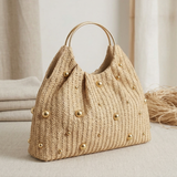 Artisanal Studded Handwoven Raffia Bag with Sculptural Gold Ring Handle