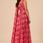 "Raspberry floral chiffon one-shoulder maxi dress with pleated bodice and flowing tie scarf."
