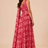 "Raspberry floral chiffon one-shoulder maxi dress with pleated bodice and flowing tie scarf."
