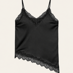 Alexine black satin camisole with floral lace neckline and asymmetric lace hem on an ivory background