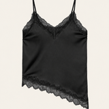 Alexine black satin camisole with floral lace neckline and asymmetric lace hem on an ivory background