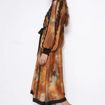 Ambre Poétique orange abstract-print lace-trim maxi dress, side view with blouson sleeve