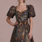 Autumn Reverie Jacquard Midi Dress — Close-up of the sweetheart neckline, puff sleeves and textured brown multi jacquard