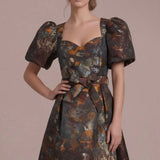 Autumn Reverie Jacquard Midi Dress — Close-up of the sweetheart neckline, puff sleeves and textured brown multi jacquard