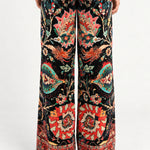 Back view of Aveline Black Aubussy printed velvet wide-leg pants on model