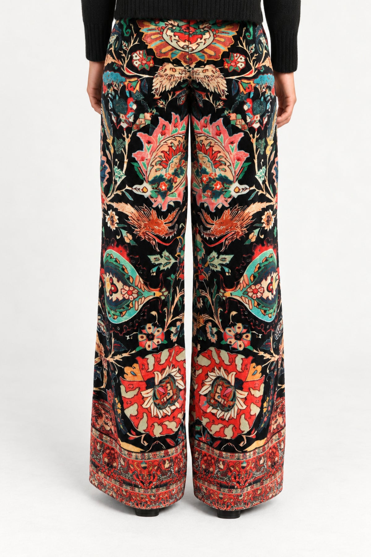 Back view of Aveline Black Aubussy printed velvet wide-leg pants on model