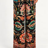 Waist-down front view of Aveline Black Aubussy wide-leg pants and patterned hem