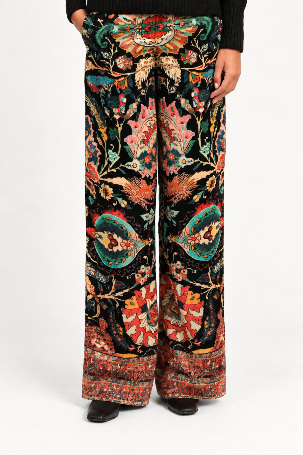 Waist-down front view of Aveline Black Aubussy wide-leg pants and patterned hem
