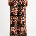 Aveline Doriala Multi floral velvet pants, back view on model