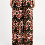 Aveline Doriala Multi floral velvet pants, back view on model