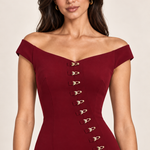 Bordeaux Allure off-shoulder neckline and gold clasp detail, generated close-up