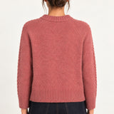 Clémence cable-detail crewneck sweater in Rosewood, back model view on an ivory backdrop