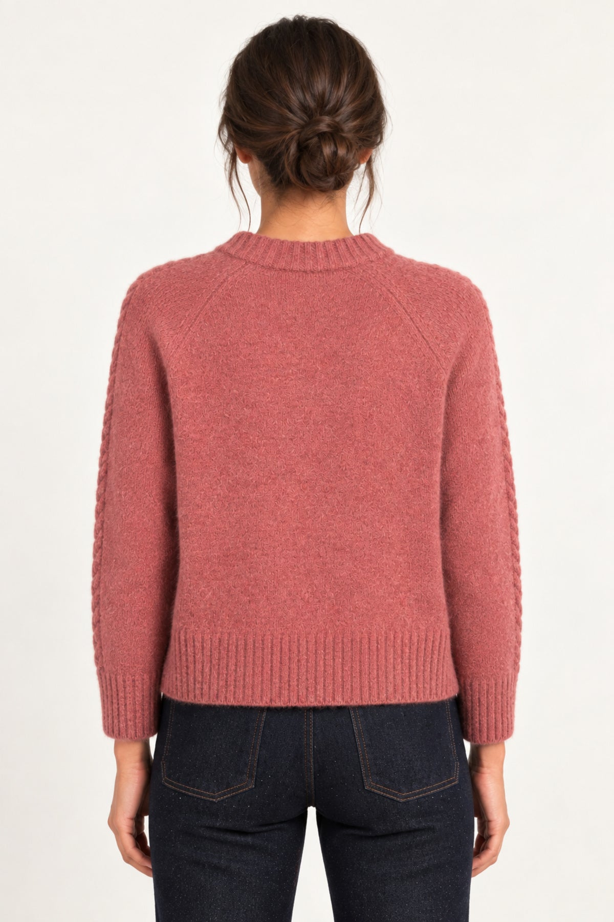 Clémence cable-detail crewneck sweater in Rosewood, back model view on an ivory backdrop