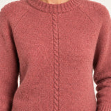 Clémence cable-detail crewneck sweater in Rosewood, close up model view on an ivory backdrop