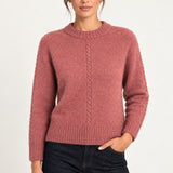 Clémence cable-detail crewneck sweater in Rosewood, front model view on an ivory backdrop
