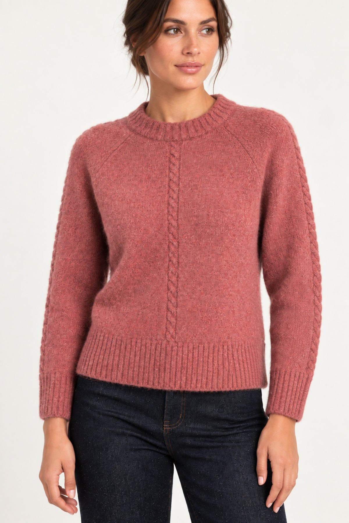 Clémence cable-detail crewneck sweater in Rosewood, half shot model view on an ivory backdrop
