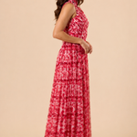 "Raspberry floral chiffon one-shoulder maxi dress with pleated bodice and flowing tie scarf."
