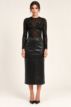 Élodie black faux-leather midi skirt, front view styled with a black lace top