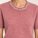 Close-up of the Émeline Rose sweater's jeweled crew neckline, short sleeve and soft knit texture