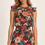 Floral jacquard fabric and structured shoulder flap detail