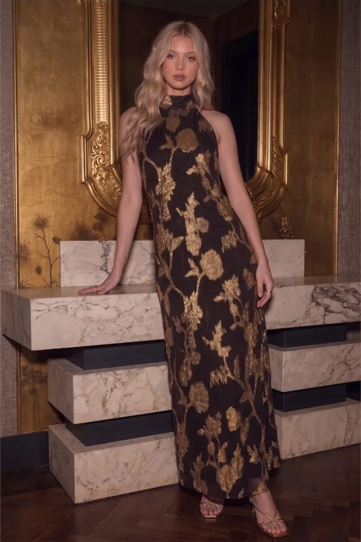 Front view of the Gilded Bloom Halter Jacquard Dress in brown with metallic gold florals