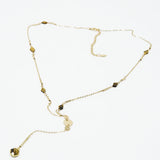 Golden necklace with stone detail and pendant