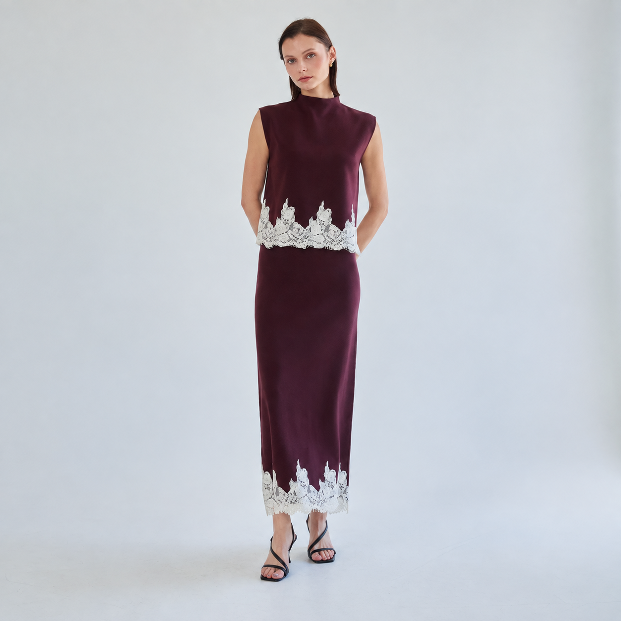 Full front view of Grenat Dentelle burgundy knit top and maxi skirt set with ivory lace hems