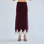 High-waisted burgundy maxi skirt with ivory floral lace hem