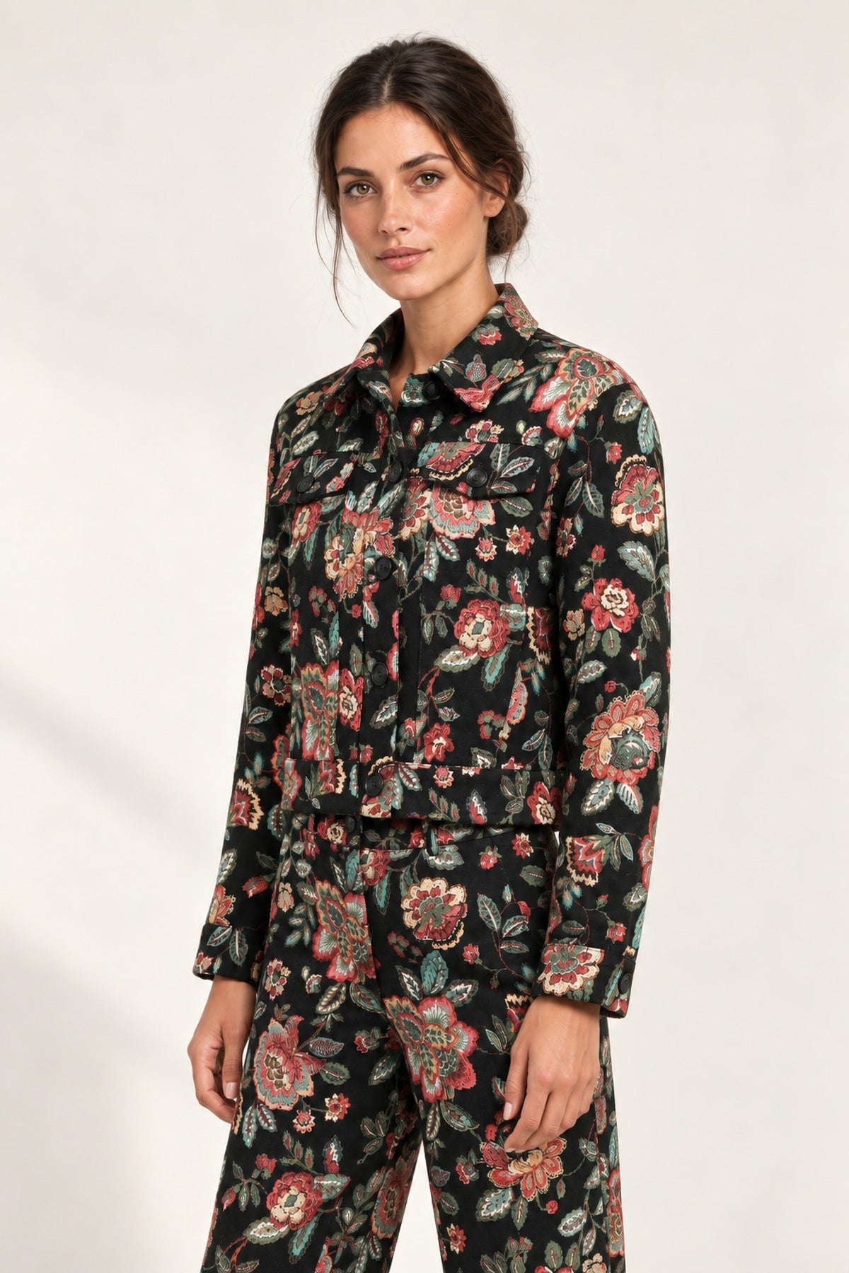 Three-quarter view of the Héloïse Jacquard Jacket in Black Floral, showing the short silhouette