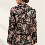 Back view of the Héloïse Jacquard Jacket in Black Floral, showing the back yoke and button cuffs