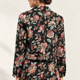 Back view of the Héloïse Jacquard Jacket in Black Floral, showing the back yoke and button cuffs