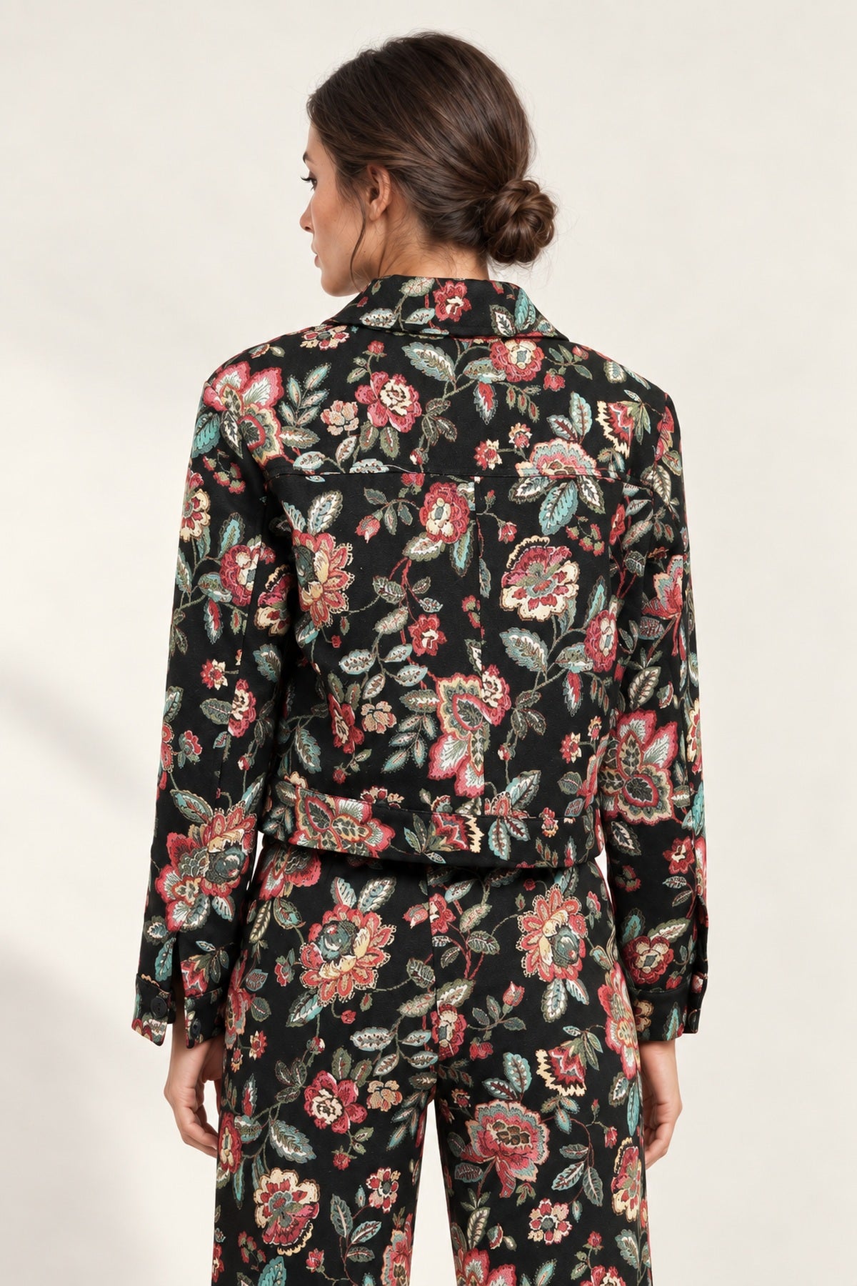 Back view of the Héloïse Jacquard Jacket in Black Floral, showing the back yoke and button cuffs