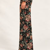 Side view of Héloïse Jacquard Wide-Leg Pants in Black Floral, showing the full-length flared cut
