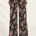 Rear view of Héloïse Jacquard Wide-Leg Pants in Black Floral against an ivory background