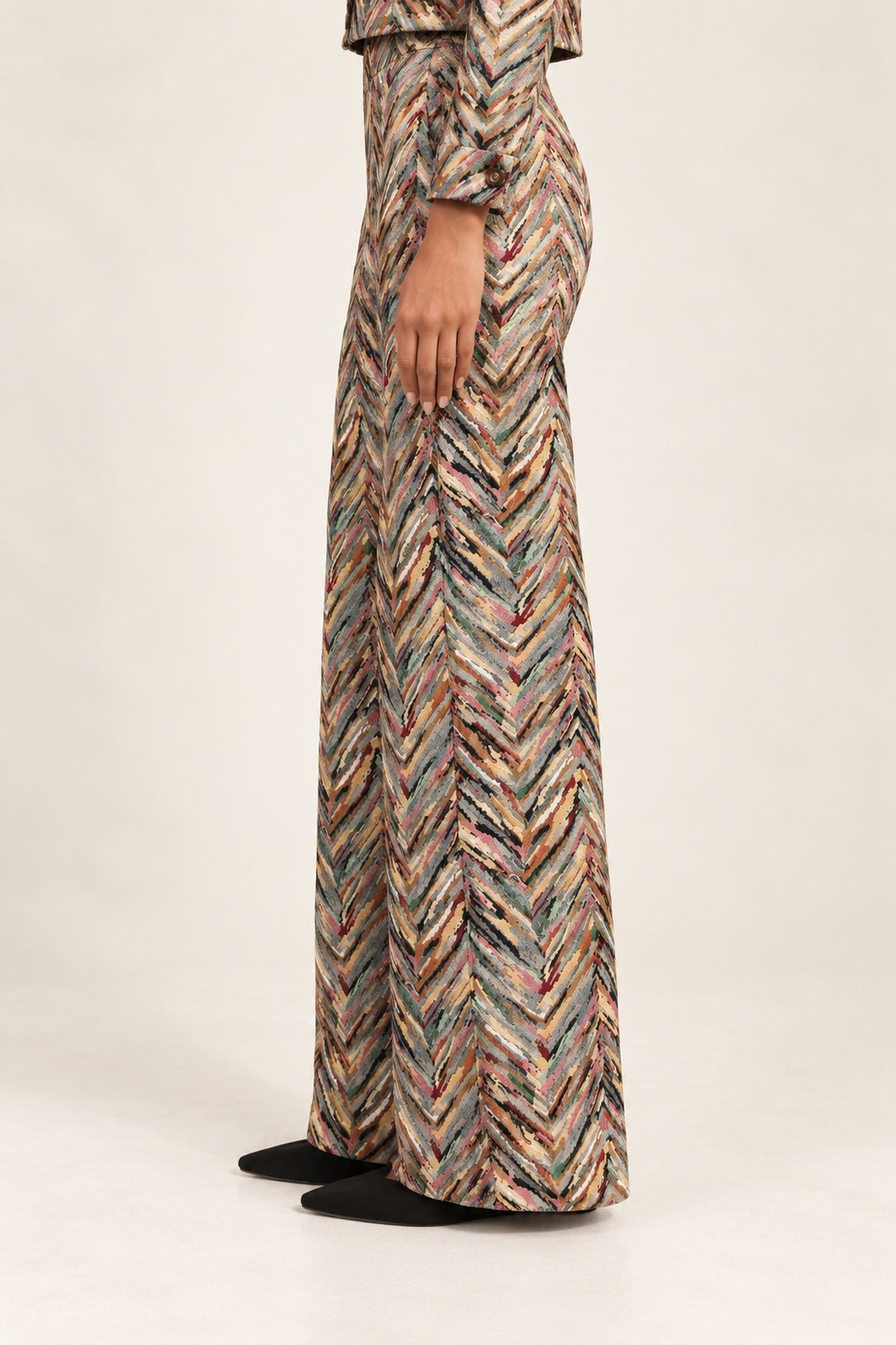 Side view of Héloïse Jacquard Wide-Leg Pants in Multico Chevron, showing the full-length flared silhouette
