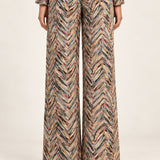 Rear view of Héloïse Jacquard Wide-Leg Pants in Multico Chevron against an ivory background