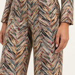 Close-up of the Héloïse Multico Chevron pants waistband, side pocket and jacquard texture